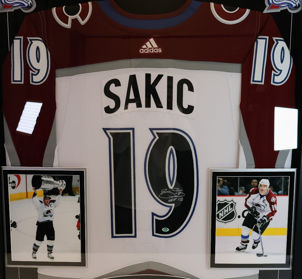 Joe Sakic Autographed Colorado Avalanche White Jersey with "HOF 12" Inscription - Latitude Sports Hologram
