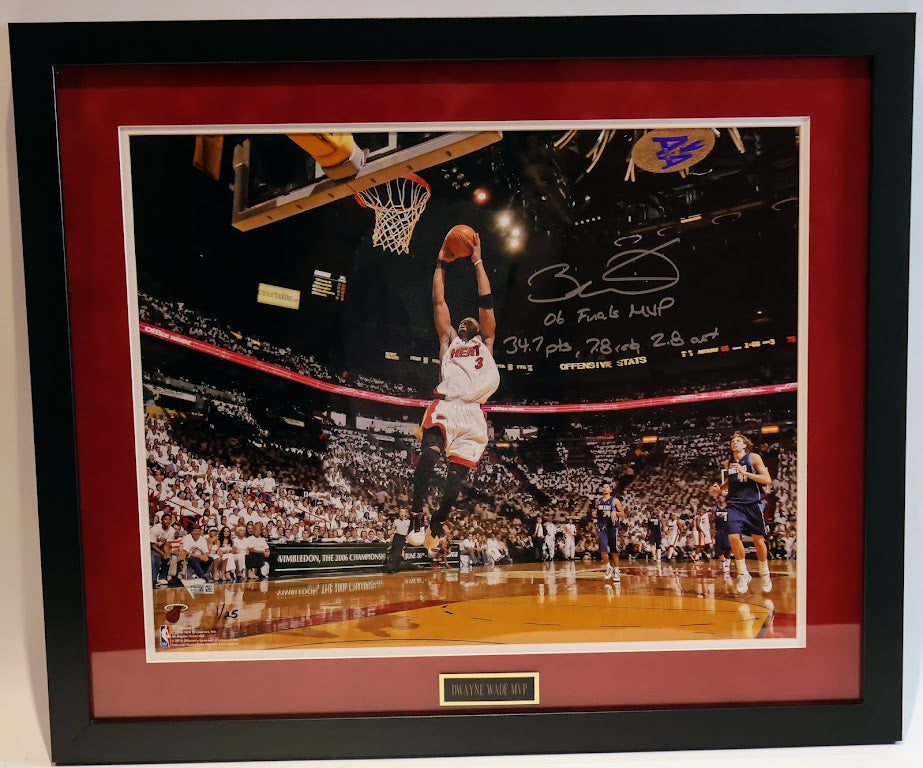 Dwayne Wade Autographed Action Shot With "06 Finals MVP", "34.7PTS", "7.8 reb", and "2.8 ast" inscriptions  LE #1-25 - Fantatics