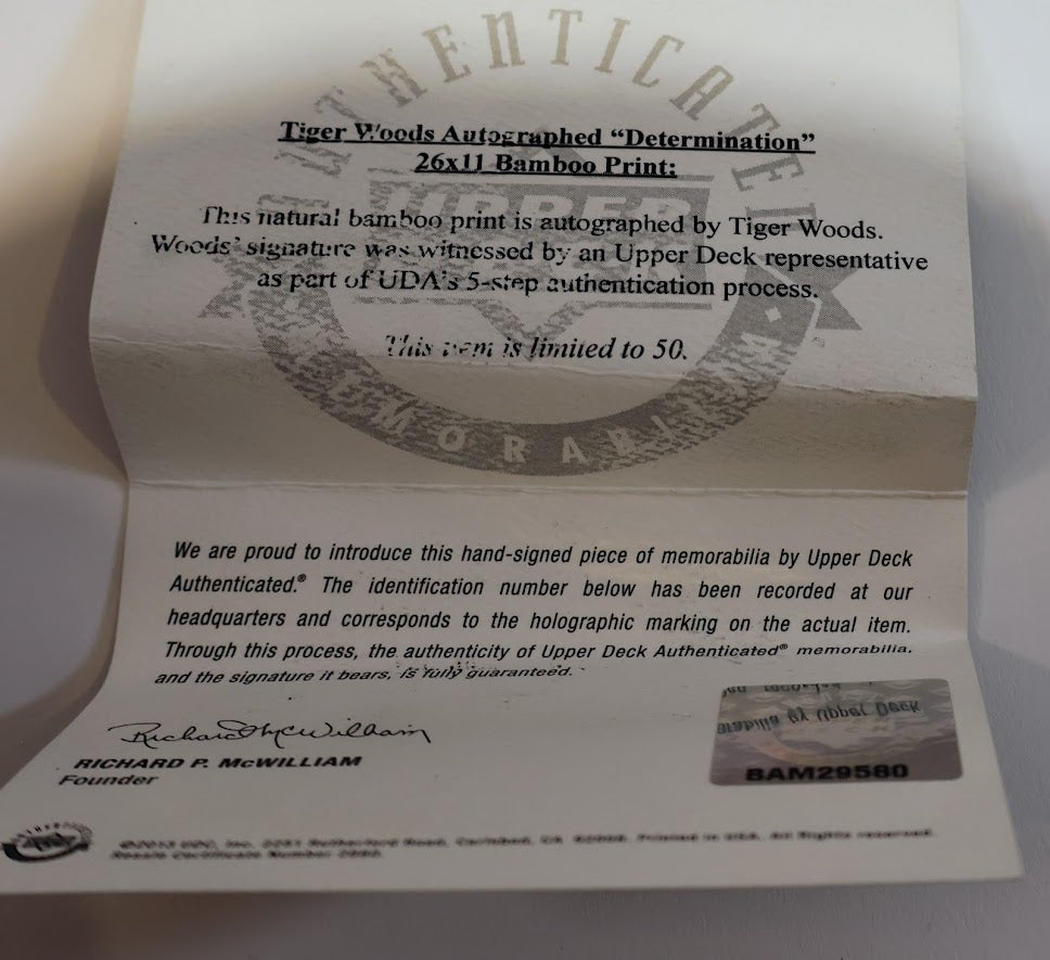 Tiger woods Autographed Unframed 11x25 Determination Photo - Upper Deck COA