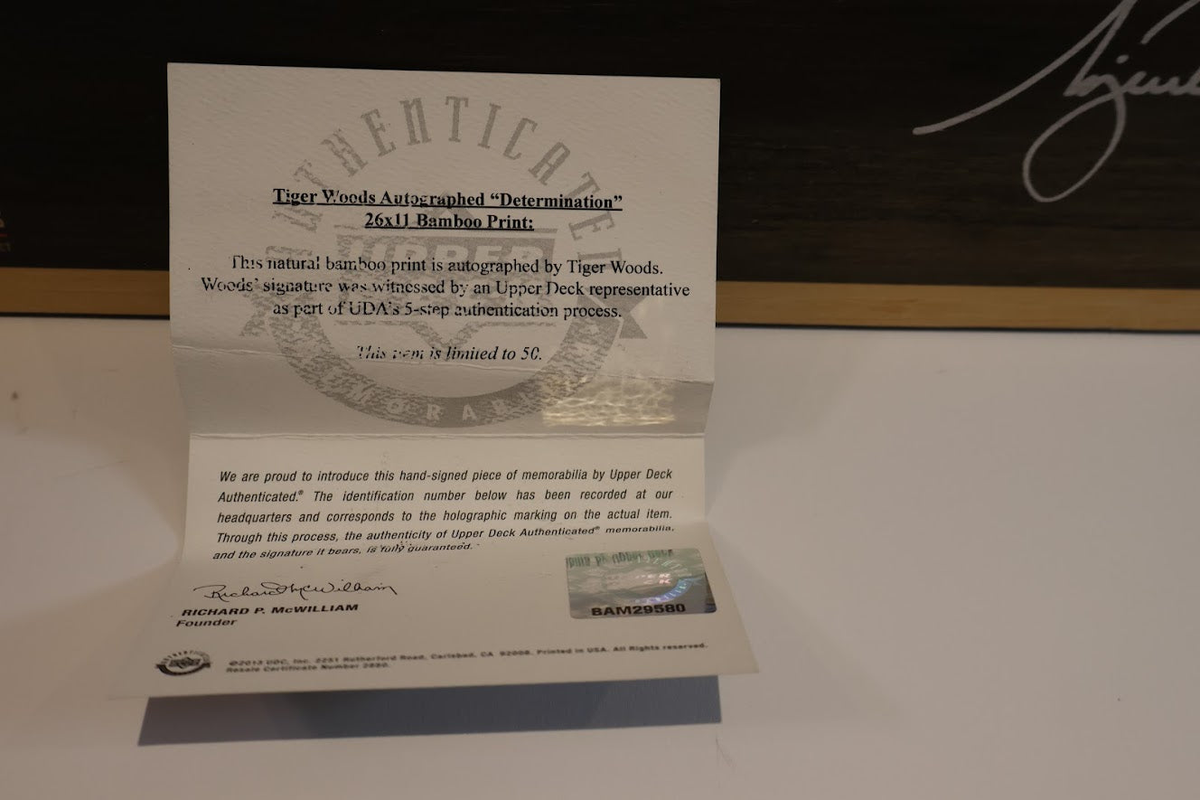 Tiger woods Autographed Unframed 11x25 Determination Photo - Upper Deck COA