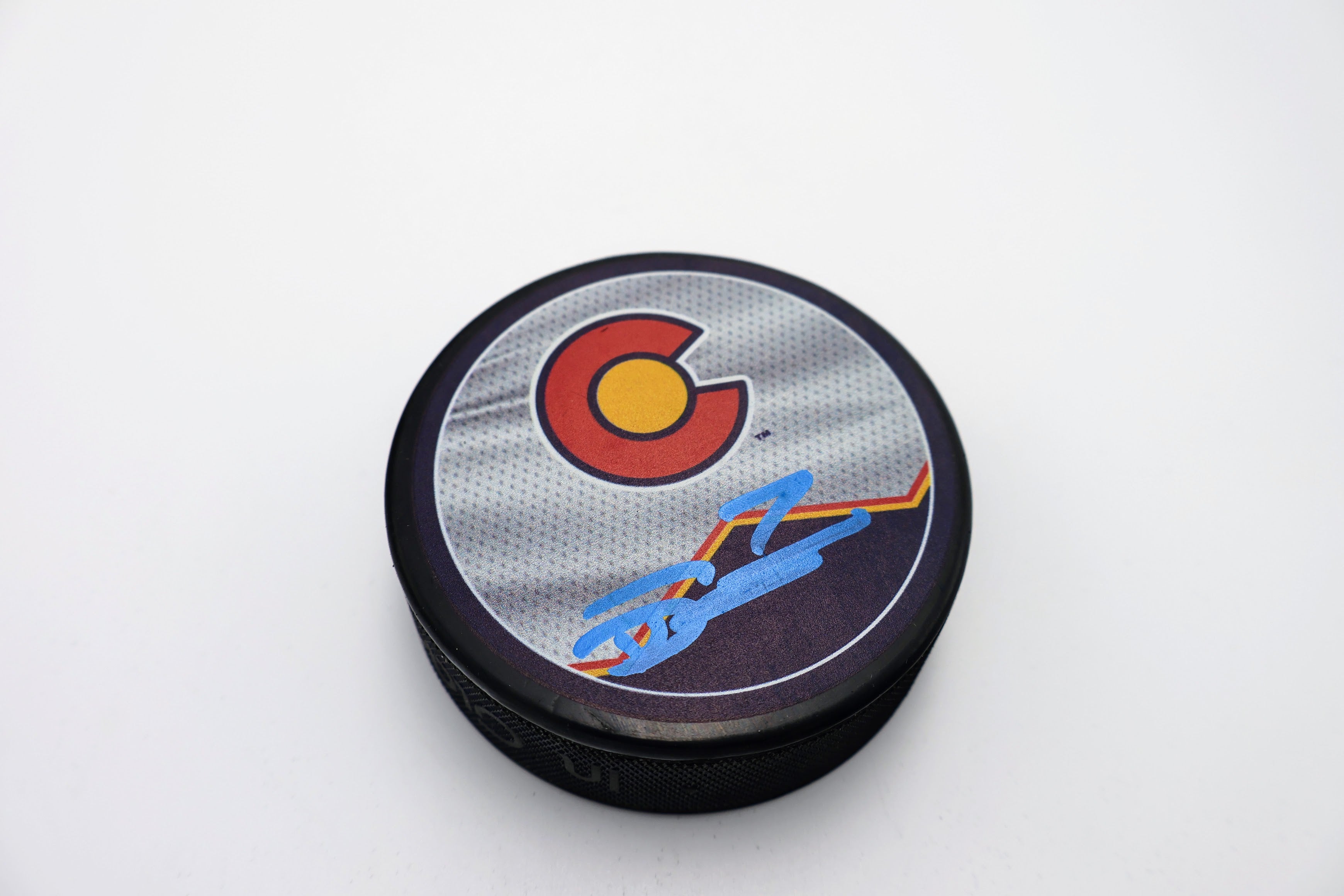 Devon Toews Colorado Avalanche "C" Logo Autographed Puck - Latitude Sports Marketing