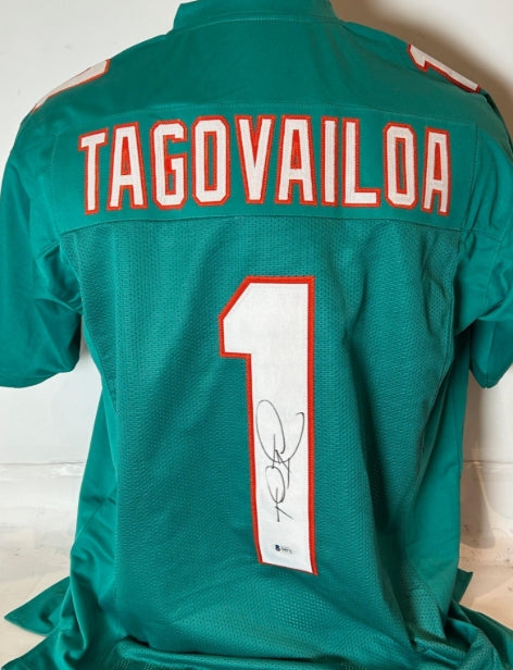 Tua Tagovailoa Autographed Teal Custom Miami Dolphins Jersey - Beckett COA - Latitude Sports Marketing